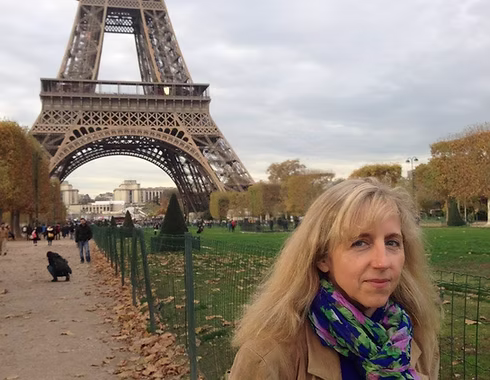 Maureen Aitken in front of Eiffel Tower